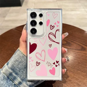 Sec6c8414e8284bc88e6117498109f778M.webp غطاء فاخر على شكل قلب لعيد الحب لهواتف سامسونج جالاكسي S21 وS25 وS24 ألترا وS22 FE وS23 بلس وA55 وA56 5G وA16 وA35، غطاء شفاف ناعم